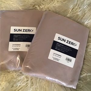 A total of 2 sun zero curtain panels size 54x63 new in package